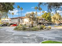 Community exterior with fountain, landscaping, and parking at 7557 N Dreamy Draw Dr # 154, Phoenix, AZ 85020