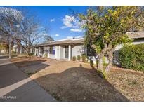 Charming single-story home with a well-maintained front yard at 8837 N New World Dr, Glendale, AZ 85302