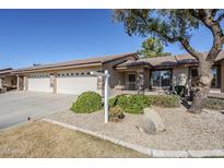 Single-level home with three-car garage and landscaped front yard at 11360 E Keats Ave # 78, Mesa, AZ 85209