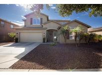 Two-story home with a large front yard at 11967 W Vernon Ave, Avondale, AZ 85392