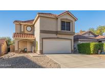Charming two-story home with a terracotta roof and well-maintained front yard at 18611 N 22Nd St # 2, Phoenix, AZ 85024