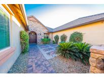 Inviting front entrance with stone accents and landscaped courtyard at 2835 E Athena Ct, Gilbert, AZ 85297