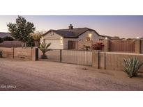 House exterior with gated entry and desert landscaping at 35119 N 10Th St, Phoenix, AZ 85086