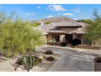Stunning single-story home with desert landscaping, tile roof, and mountain views at 7487 E Visao Dr, Scottsdale, AZ 85266