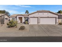 3-car garage and desert landscaping at 1102 E Bartlett Way, Chandler, AZ 85249