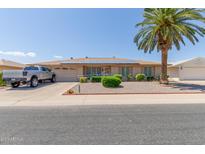 Ranch-style home with solar panels and landscaped yard at 11030 W Pleasant Valley W Rd, Sun City, AZ 85351