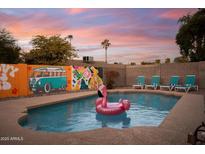 Inviting backyard pool with fun mural and lounge chairs at 1134 W Dunbar Dr, Tempe, AZ 85282