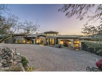 Stunning luxury home with stone accents and a circular driveway at 15402 E Crested Butte Trl, Fountain Hills, AZ 85268