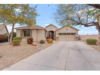 One-story home with a landscaped front yard and two-car garage at 2106 W Ian Dr, Phoenix, AZ 85041