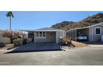 Mobile home exterior with carport and mountain views at 2233 E Behrend Dr # 197, Phoenix, AZ 85024