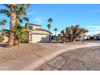 Two-story house with desert landscaping and a two-car garage at 3024 E Siesta Ln, Phoenix, AZ 85050