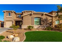 Two-story house with landscaped lawn and attached two-car garage at 472 W Dragon Tree Ave, Queen Creek, AZ 85140