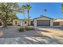 Single-story home with desert landscaping and a two-car garage at 7520 N Via De Manana --, Scottsdale, AZ 85258