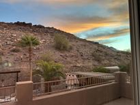 Scenic view of desert landscape, mountains, and a private backyard with patio at 926 E Mountain Sky Ave, Phoenix, AZ 85048