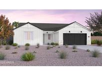 One-story home with white siding, a black garage door, and landscaping at 1304 W Golden Ore Pass, Apache Junction, AZ 85120