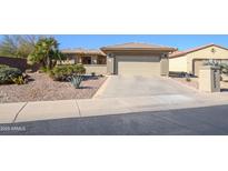 Single-story home with two-car garage and desert landscaping at 20716 N Shadow Mountain Dr, Surprise, AZ 85374