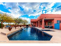 Resort-style pool with waterfall and spacious patio at 31825 N 141St St, Scottsdale, AZ 85262