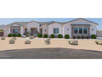 Beautiful farmhouse exterior with landscaping and desert accents at 3640 W Josiah Trl, Queen Creek, AZ 85144
