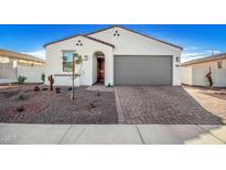 Single-story home with gray garage door and desert landscaping at 17765 W Silverwood Dr, Goodyear, AZ 85338