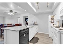 Updated kitchen, featuring granite countertops and white cabinetry at 1920 W Lindner Ave # 130, Mesa, AZ 85202