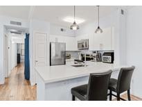 Modern kitchen with stainless steel appliances and white cabinetry at 20100 N 78Th Pl # 2091, Scottsdale, AZ 85255