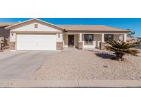 One-story home with a two-car garage and desert landscaping at 2101 S Meridian Rd # 268, Apache Junction, AZ 85120