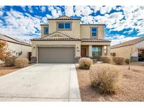 Two-story house with a brown garage door and landscaping at 3641 N 309Th Dr, Buckeye, AZ 85396