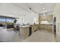 Modern kitchen with stainless steel appliances and an island at 7180 E Kierland Blvd # 1209, Scottsdale, AZ 85254