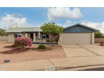 Ranch style home with landscaped yard, two-car garage, and driveway at 8361 E Lakeview Ave, Mesa, AZ 85209