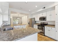Modern kitchen with stainless steel appliances and granite countertops at 8653 E Royal Palm Rd # 2014, Scottsdale, AZ 85258