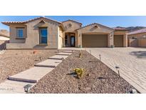 Beautiful desert landscape and two-car garage at 16221 S 35Th Dr, Phoenix, AZ 85045