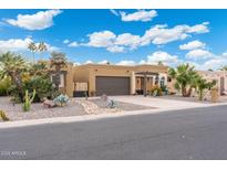 Single-story home with desert landscaping and a two-car garage at 9209 E Citrus N Ln, Sun Lakes, AZ 85248