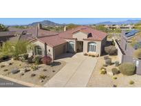 Single-level home with tile roof, driveway, and desert landscaping; mountain views at 9514 E Cavalry Dr, Scottsdale, AZ 85262