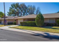 Single-story home with a well-manicured lawn and attached garage at 9614 N 110Th Ave, Sun City, AZ 85351