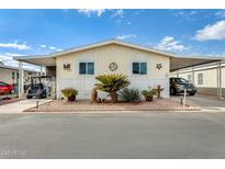 Inviting single-wide manufactured home with carport and landscaped yard at 11596 W Sierra Dawn Blvd # 134, Surprise, AZ 85378