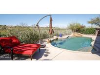 Inviting backyard oasis with a sparkling pool and relaxing lounge chair at 15720 E Yucca Dr, Fountain Hills, AZ 85268
