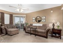 Living room with couch, chair, and decorative pieces at 1720 E Thunderbird Rd # 2059, Phoenix, AZ 85022