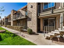 Complex exterior showing building, landscaping, and walkway at 2228 E Campbell Ave # 116, Phoenix, AZ 85016