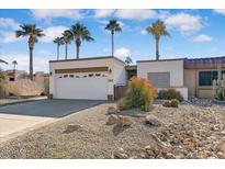 Single-level home with desert landscaping, two-car garage, and gated entry at 17019 E Calaveras Ave, Fountain Hills, AZ 85268