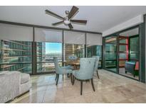 Modern dining area with city views and access to a balcony at 4808 N 24Th St # 1123, Phoenix, AZ 85016