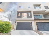 Modern two-story home with attached garage and landscaped front yard at 6850 E Mcdowell Rd # 7, Scottsdale, AZ 85257