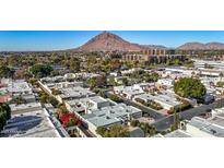 Aerial view of community with Camelback Mountain in the background at 6945 E Glenrosa Ave, Scottsdale, AZ 85251