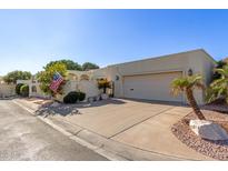 Single story home with light colored stucco and attached garage at 6945 E Glenrosa Ave, Scottsdale, AZ 85251