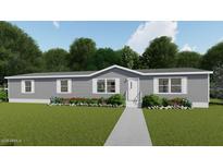 Single-story manufactured home with gray siding and landscaping at 000 W Pony Rd, Maricopa, AZ 85139