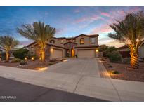 Two-story home with a three-car garage and palm trees at 3457 E Virgil Dr, Gilbert, AZ 85298