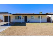 Cute ranch home with carport and grassy front yard at 3614 N 48Th Dr, Phoenix, AZ 85031