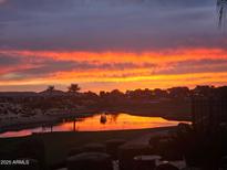 Beautiful lake view with an amazing Arizona sunset, reflected in the water at 36709 N Stoneware Dr, San Tan Valley, AZ 85140