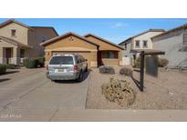 Single-story house with a driveway and landscaped yard at 41240 W Capistrano Dr, Maricopa, AZ 85138