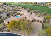 Luxury home with pool, expansive driveway, and stunning desert landscape views at 10712 E Greythorn Dr, Scottsdale, AZ 85262