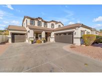 Two-story house with a three-car garage and landscaping at 19646 E Reins Rd, Queen Creek, AZ 85142